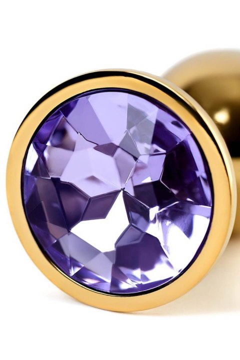 Golden anal plug TOYFA Metal,with a amethyst colored gem Golden anal plug TOYFA Metal,with a amethyst colored gem