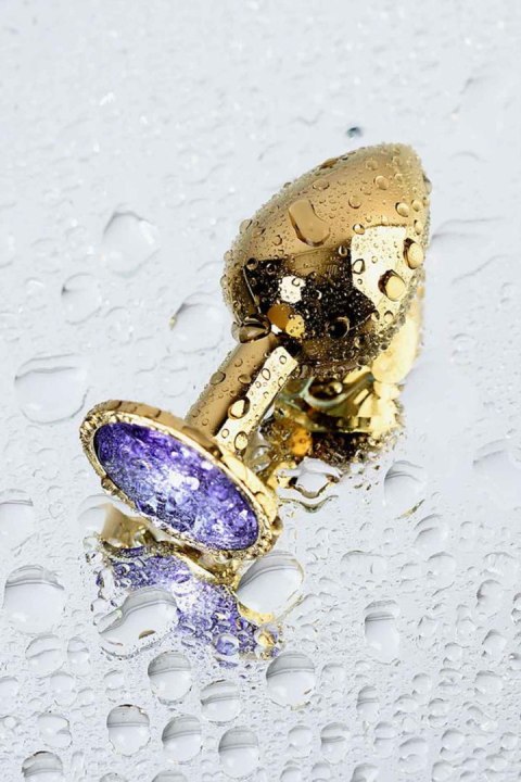 Golden anal plug TOYFA Metal,with a amethyst colored gem Golden anal plug TOYFA Metal,with a amethyst colored gem