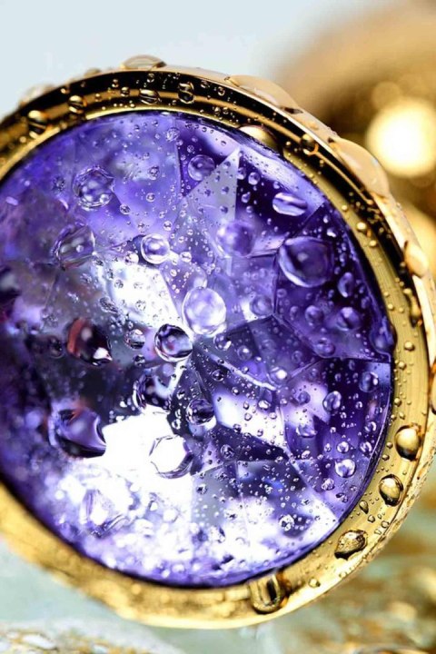 Golden anal plug TOYFA Metal,with a amethyst colored gem Golden anal plug TOYFA Metal,with a amethyst colored gem