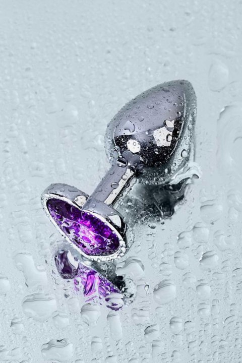 Silver anal plug with purple gem heart-shaped Silver anal plug with purple gem heart-shaped